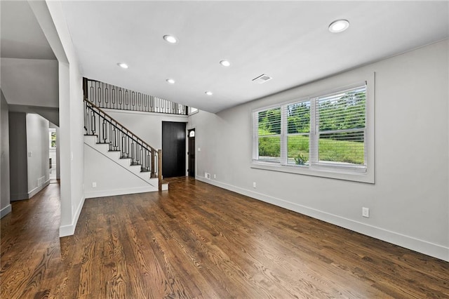 1887 Shalimar Dr, Atlanta, GA 30345 - unfurnished living room with baseboards, stairway, wood finished floors, and recessed lighting