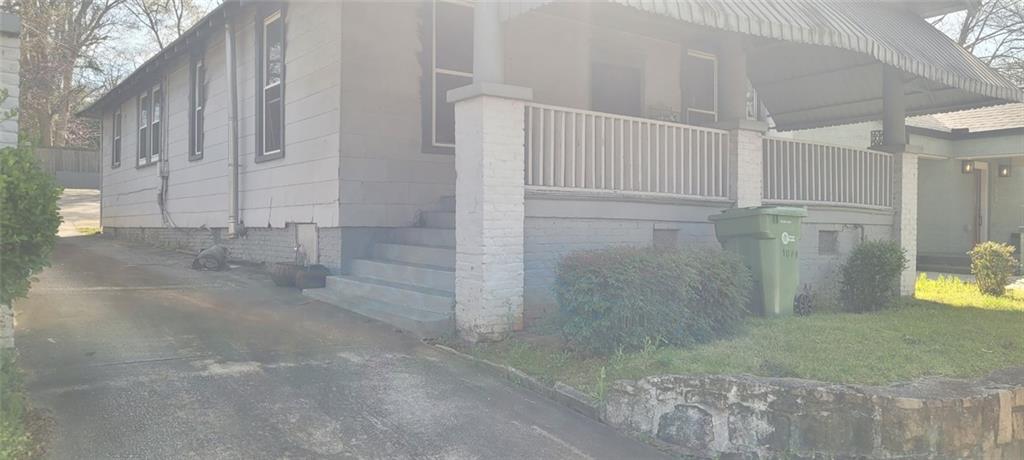 view of side of property featuring a balcony