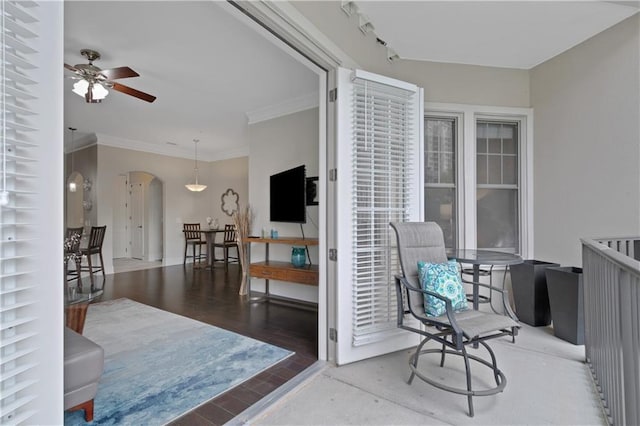 interior space with ceiling fan