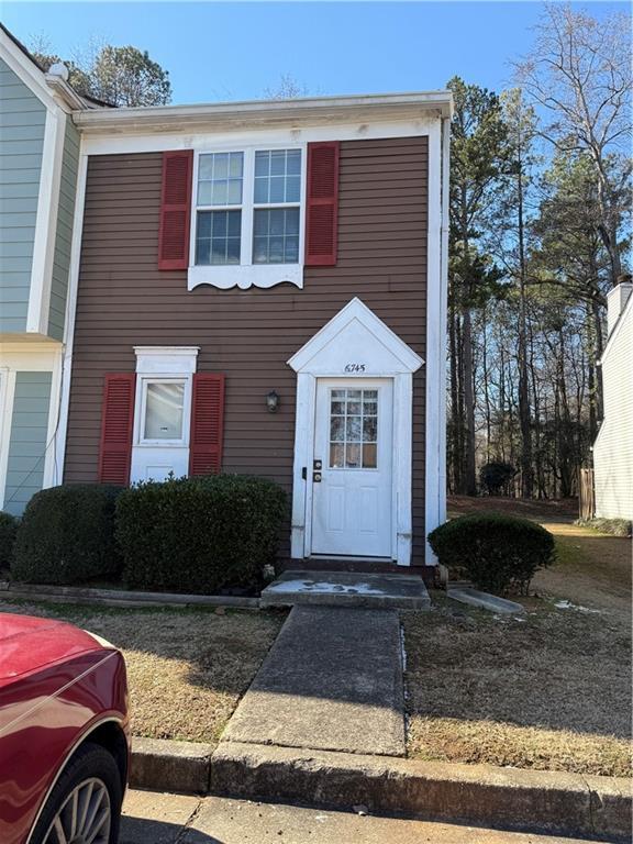 6745 Trafalger Sq, Norcross, GA 30093 - kitchen with stainless steel appliances, light hardwood / wood-style floors, white cabinetry, sink, and light stone countertops