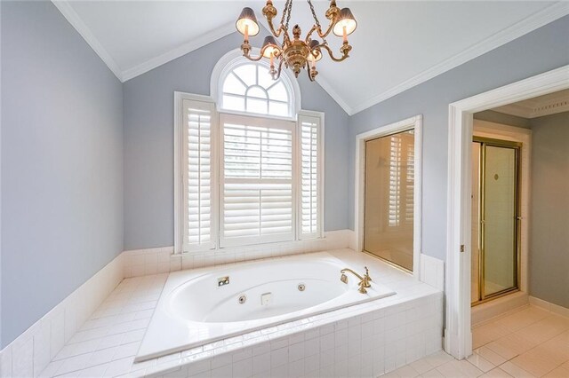 bathroom with a wealth of natural light, ornamental molding, lofted ceiling, and a chandelier