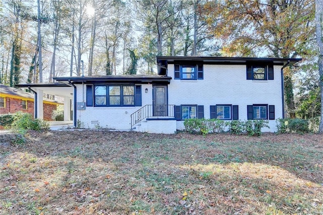 split level home featuring a carport