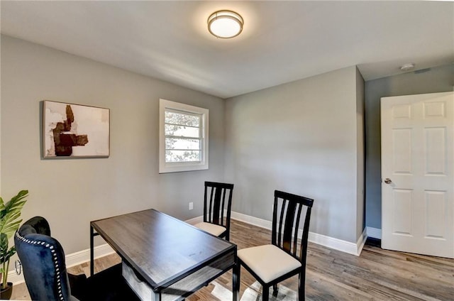 dining space featuring hardwood / wood-style flooring