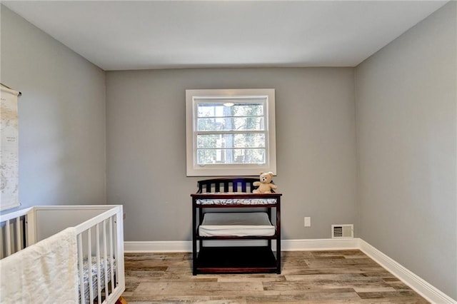 bedroom featuring wood-type flooring