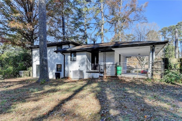 exterior space featuring a carport and cooling unit