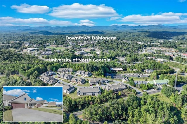 drone / aerial view featuring a mountain view