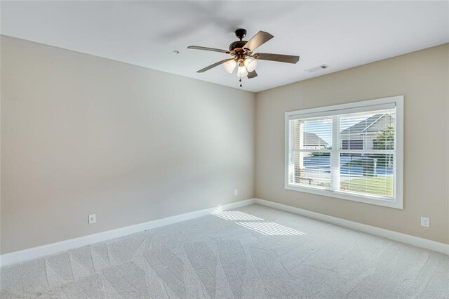 empty room with light carpet and ceiling fan