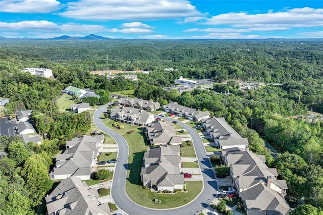 birds eye view of property with a mountain view