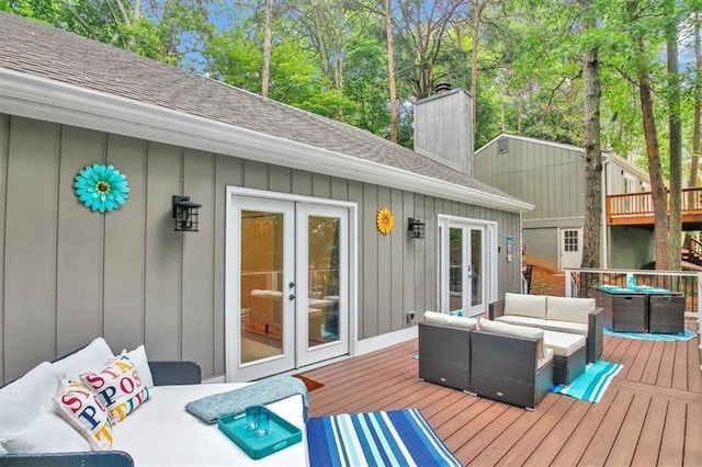 wooden terrace featuring an outdoor living space and french doors