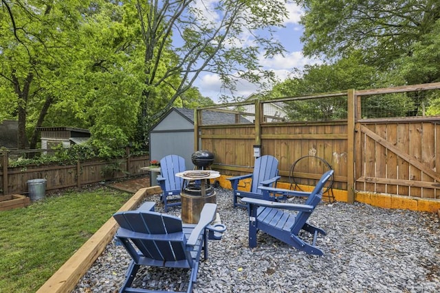 fenced backyard featuring an outdoor fire pit