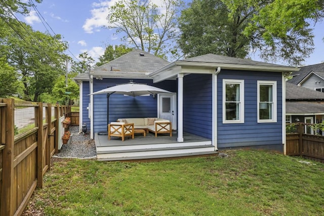 rear view of property featuring an outdoor hangout area, a wooden deck, and a shingled roof