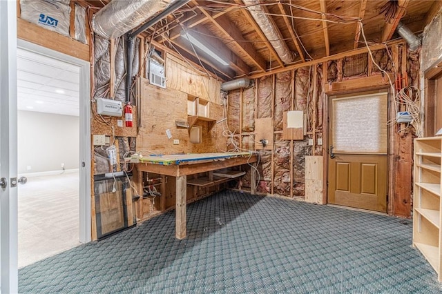 interior space featuring a workshop area and carpet