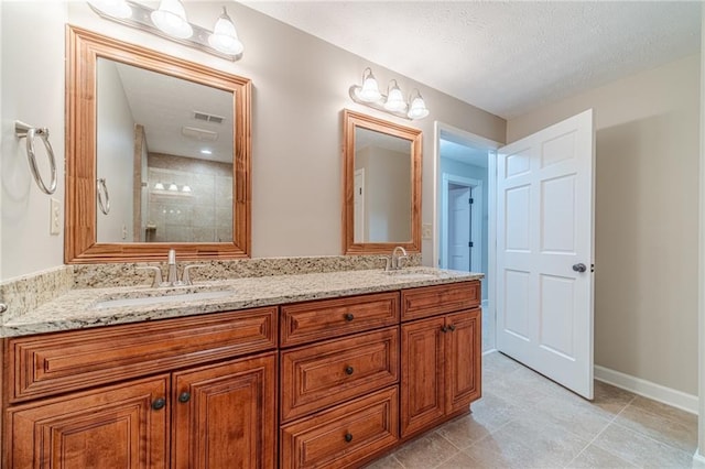 bathroom featuring tile patterned floors and vanity