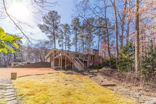 back of property featuring a wooden deck