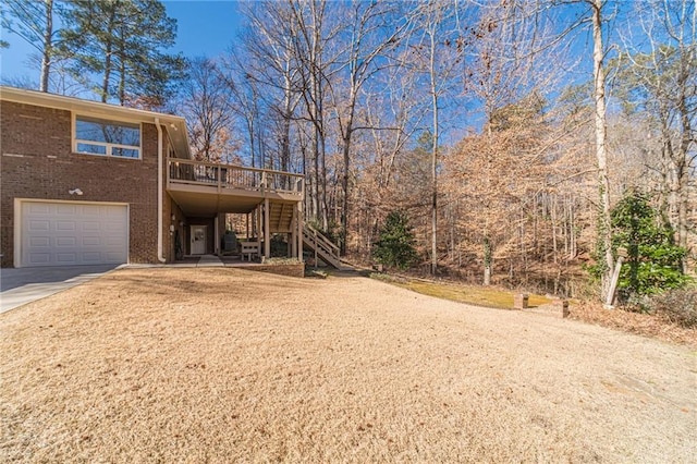 exterior space with a wooden deck and a garage