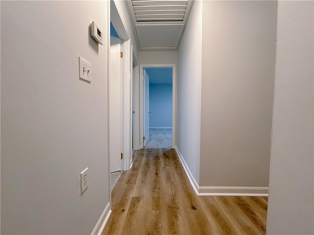 corridor with light wood-type flooring