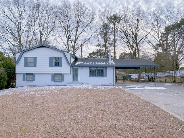 split level home featuring a carport