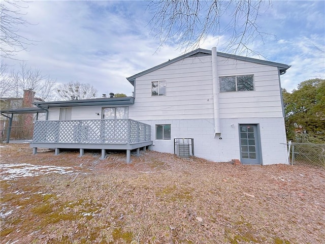 back of property with a wooden deck