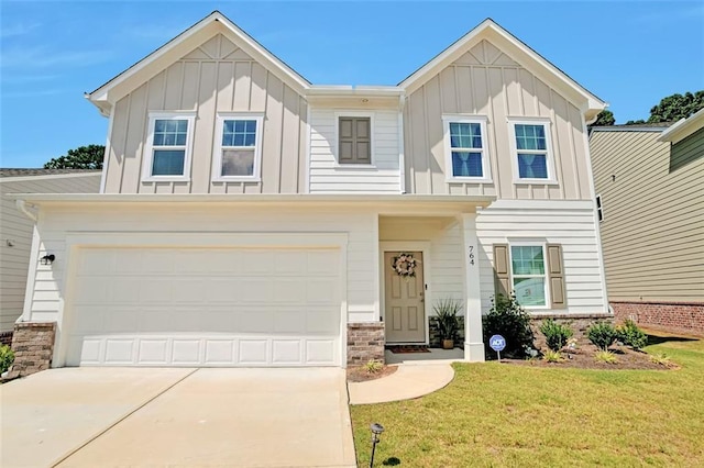 view of front of property with a garage and a front lawn