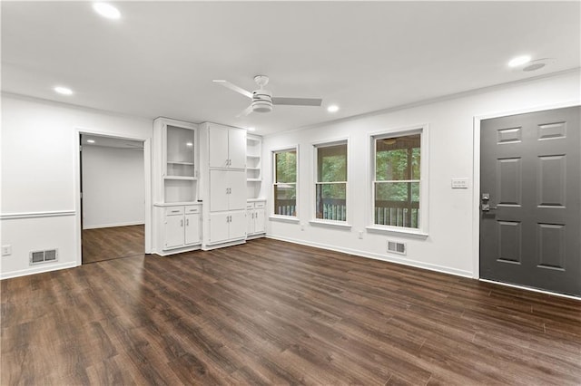 unfurnished living room featuring visible vents, dark wood-type flooring, and recessed lighting