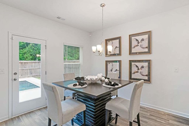 939 Brittfield Way, Loganville, GA 30052 - dining space with a chandelier and light wood-style floors