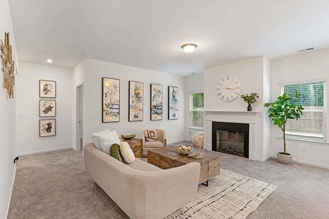 939 Brittfield Way, Loganville, GA 30052 - carpeted living area with a glass covered fireplace and recessed lighting