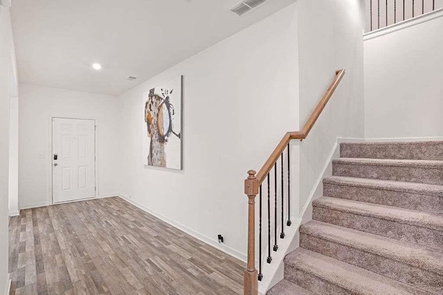 939 Brittfield Way, Loganville, GA 30052 - foyer entrance featuring stairway, wood finished floors, and recessed lighting