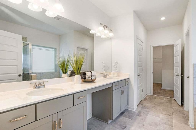 939 Brittfield Way, Loganville, GA 30052 - bathroom featuring double vanity, a shower stall, and a closet