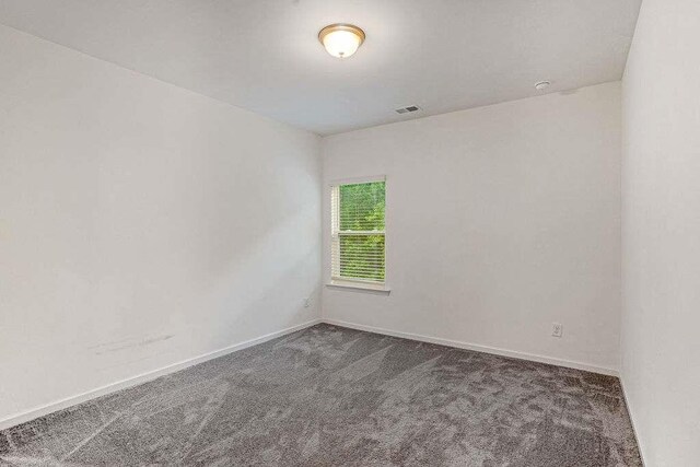 939 Brittfield Way, Loganville, GA 30052 - carpeted empty room with baseboards