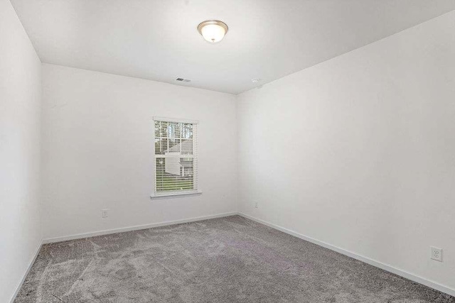 939 Brittfield Way, Loganville, GA 30052 - empty room featuring carpet and baseboards