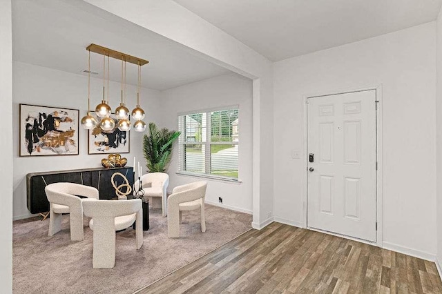 939 Brittfield Way, Loganville, GA 30052 - entrance foyer with wood finished floors and a chandelier