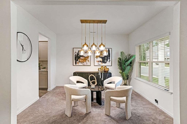 939 Brittfield Way, Loganville, GA 30052 - dining area with carpet flooring and a chandelier