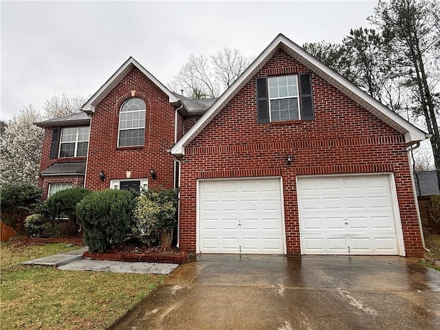 view of front facade with brick siding and concrete driveway