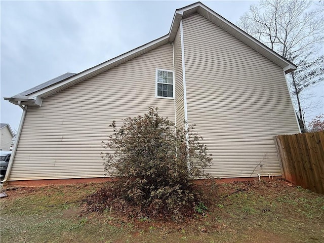 view of side of property with fence