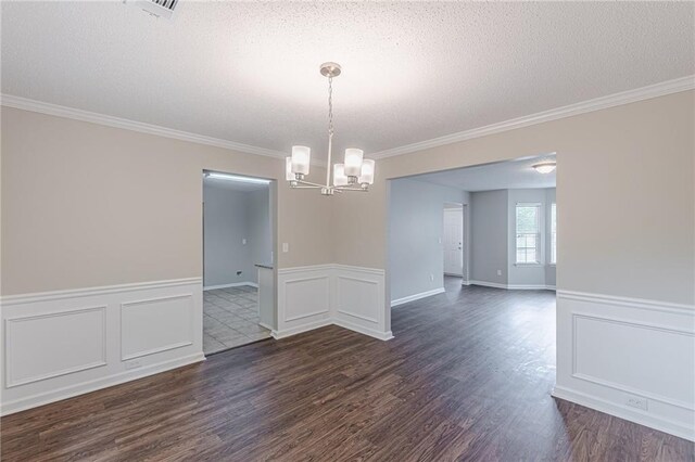 105 Kentwood Springs Dr, Hampton, GA 30228 - spare room with a notable chandelier, dark wood finished floors, crown molding, and a textured ceiling