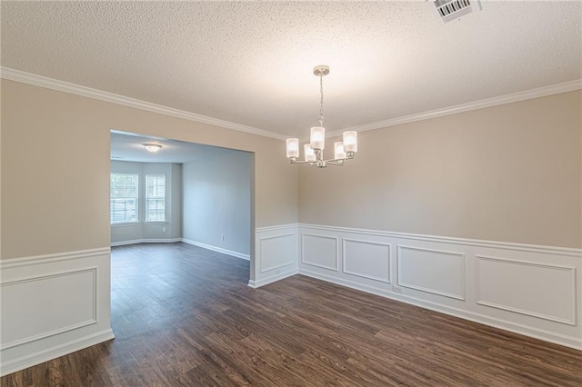 105 Kentwood Springs Dr, Hampton, GA 30228 - spare room with ornamental molding, wainscoting, an inviting chandelier, visible vents, and dark wood-style floors
