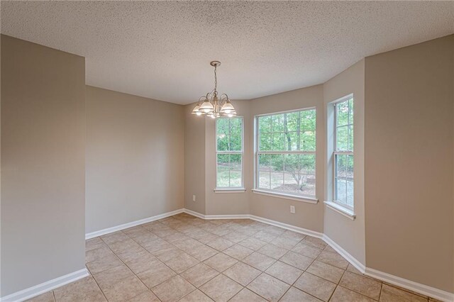 105 Kentwood Springs Dr, Hampton, GA 30228 - spare room with a textured ceiling, a wealth of natural light, and light tile patterned floors