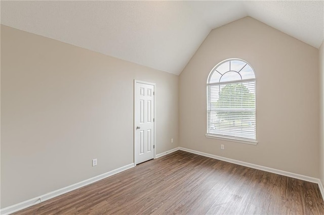 105 Kentwood Springs Dr, Hampton, GA 30228 - empty room with baseboards, vaulted ceiling, and wood finished floors