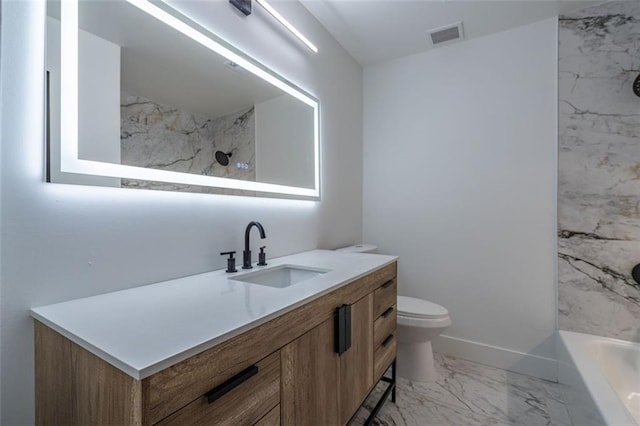 bathroom with vanity, visible vents, marble finish floor, toilet, and baseboards