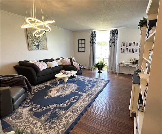 living room featuring crown molding, dark hardwood / wood-style floors, and a textured ceiling