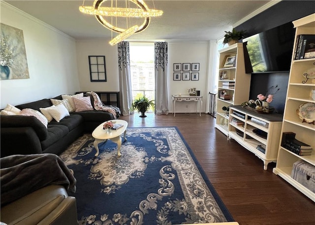 living room with crown molding, dark wood-type flooring, and an inviting chandelier