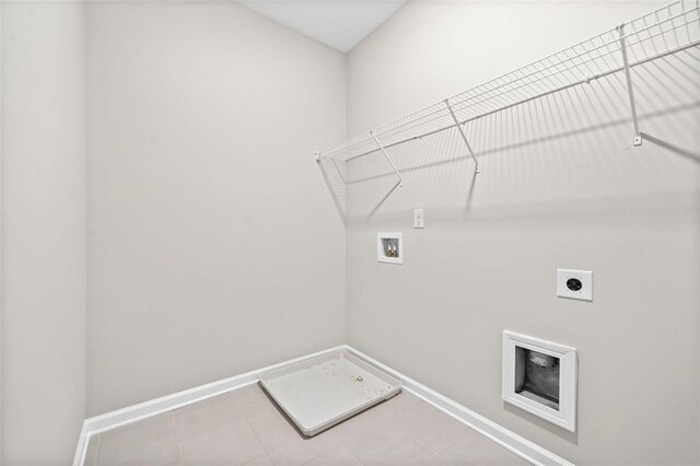 laundry room with tile patterned floors, washer hookup, and hookup for an electric dryer