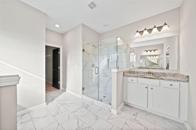 bathroom with vanity and walk in shower