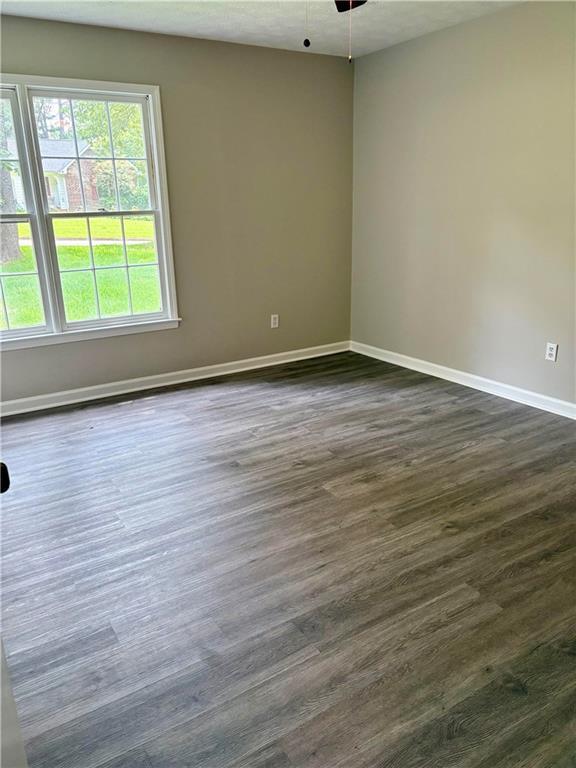 6103 Chaseland Dr, Rex, GA 30273 - unfurnished room featuring dark wood-style flooring and baseboards