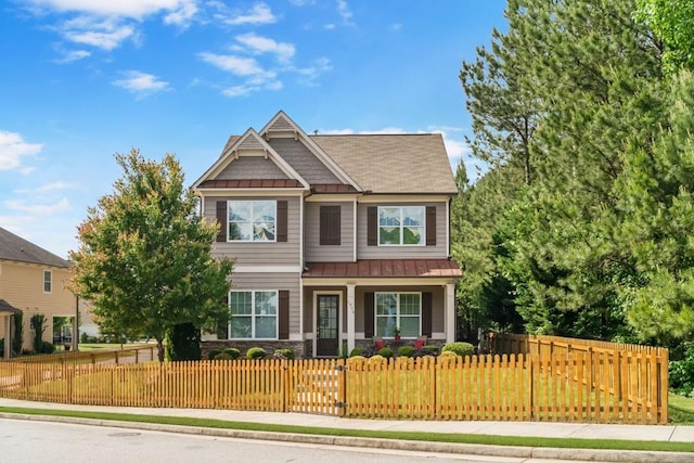 1976 Boyd Trace Ln NW, Atlanta, GA 30318 - craftsman house featuring a standing seam roof, metal roof, covered porch, a fenced front yard, and stone siding