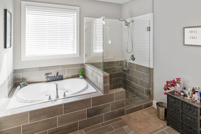 1976 Boyd Trace Ln NW, Atlanta, GA 30318 - bathroom with a stall shower and a garden tub