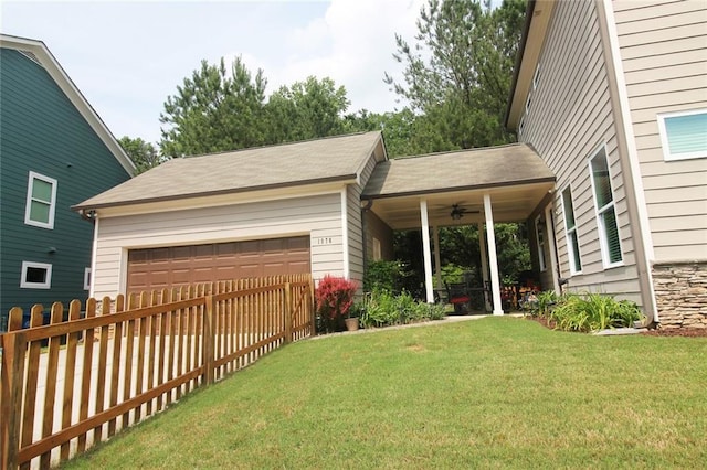 1976 Boyd Trace Ln NW, Atlanta, GA 30318 - view of yard featuring an attached garage and a ceiling fan