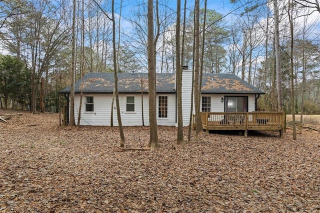 rear view of house with a wooden deck