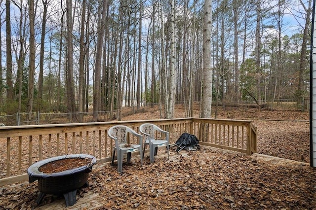 wooden deck featuring a fire pit