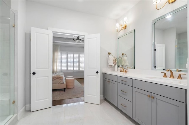 ensuite bathroom featuring double vanity, ensuite bathroom, a stall shower, a sink, and tile patterned floors